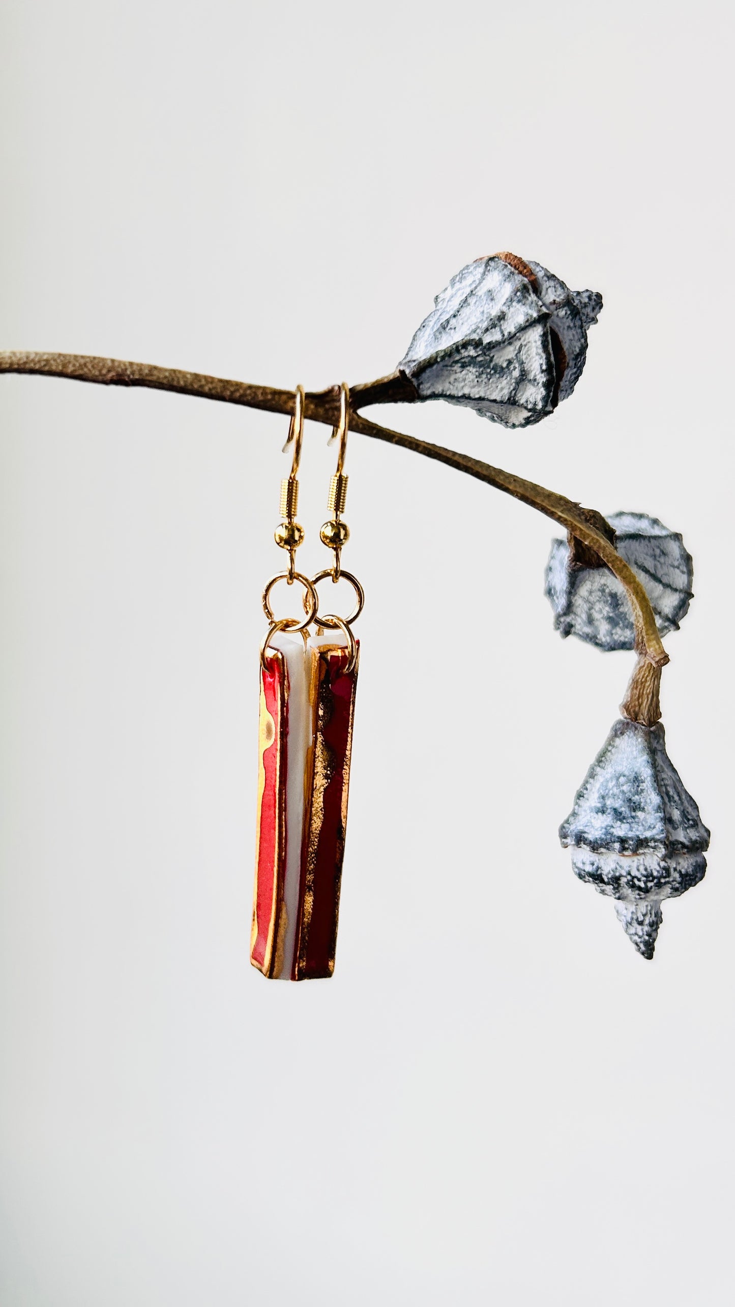 Long red porcelain earrings with 22 k gold luster